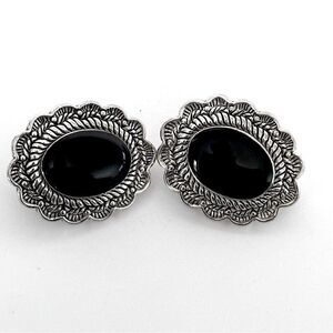 Vintage Sterling Silver Oval Clip-On Earrings with a black stone.